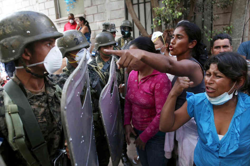 In Honduras, female relatives of inmates killed during a fire at a prison argue with soldiers as they try to enter the morgue in Tegucigalpa, the Honduran capital, on Feb. 20. The fire at Comayagua prison on Feb. 14 killed more than 300 inmates. In Honduras, female relatives of inmates killed during a fire at a prison argue with soldiers as they try to enter the morgue in Tegucigalpa, the Honduran capital, on Feb. 20. The fire at Comayagua prison on Feb. 14 killed more than 300 inmates.