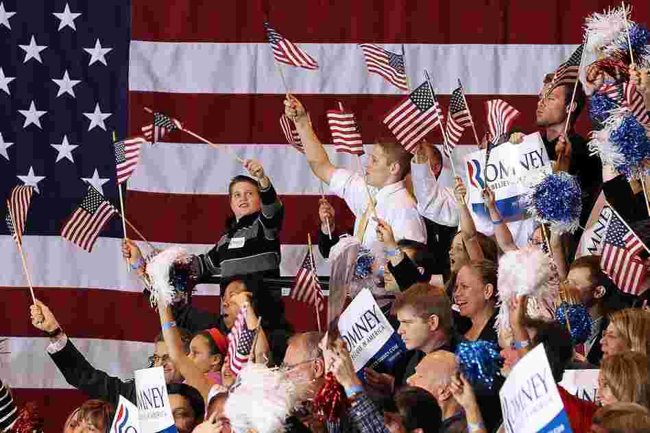 Romney supporters cheer during a primary night gathering at the Suburban Collections Showplace in Novi, Mich. 
