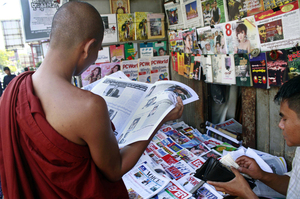 A Buddhist monk reads a newspaper in Yangon on Tuesday. Newspaper articles that would have been rejected by Myanmar's draconian state censors just months ago are making it into print, in one of many signs that the long-repressed country is becoming more open. A Buddhist monk reads a newspaper in Yangon on Tuesday. Newspaper articles that would have been rejected by Myanmar's draconian state censors just months ago are making it into print, in one of many signs that the long-repressed country is becoming more open.