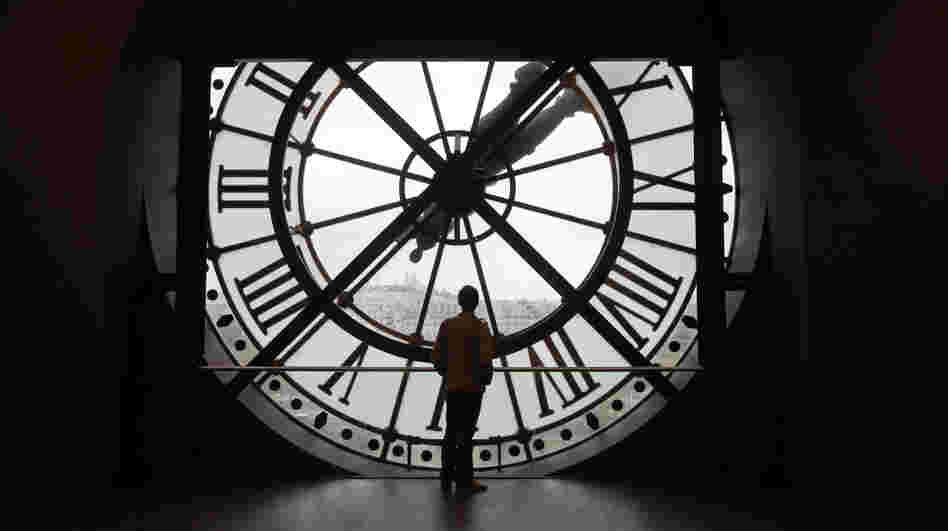 Leap day is the perfect moment to contemplate time. Here a man looks at the Seine river through the giant clock of the Orsay Museum in Paris. 