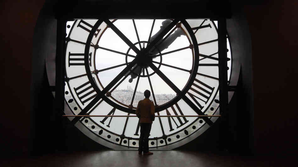 Leap day is the perfect moment to contemplate time. Here a man looks at the Seine river through the giant clock of the Orsay Museum in Paris. 