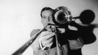 The great jazz musician and band leader Glenn Miller with his trombone. The great jazz musician and band leader Glenn Miller with his trombone.