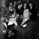 Louis 'Satchmo' Armstrong, the great jazz trumpeter and vocalist playing at the Savoy Hotel, London. Louis 'Satchmo' Armstrong, the great jazz trumpeter and vocalist playing at the Savoy Hotel, London.