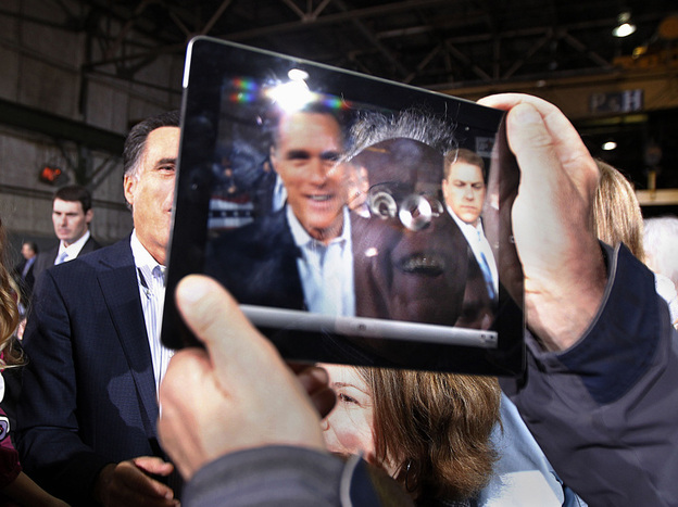 Mitt Romney was captured on the iPad screen held by a man at a campaign event in Toledo, Ohio, on Wednesday. 