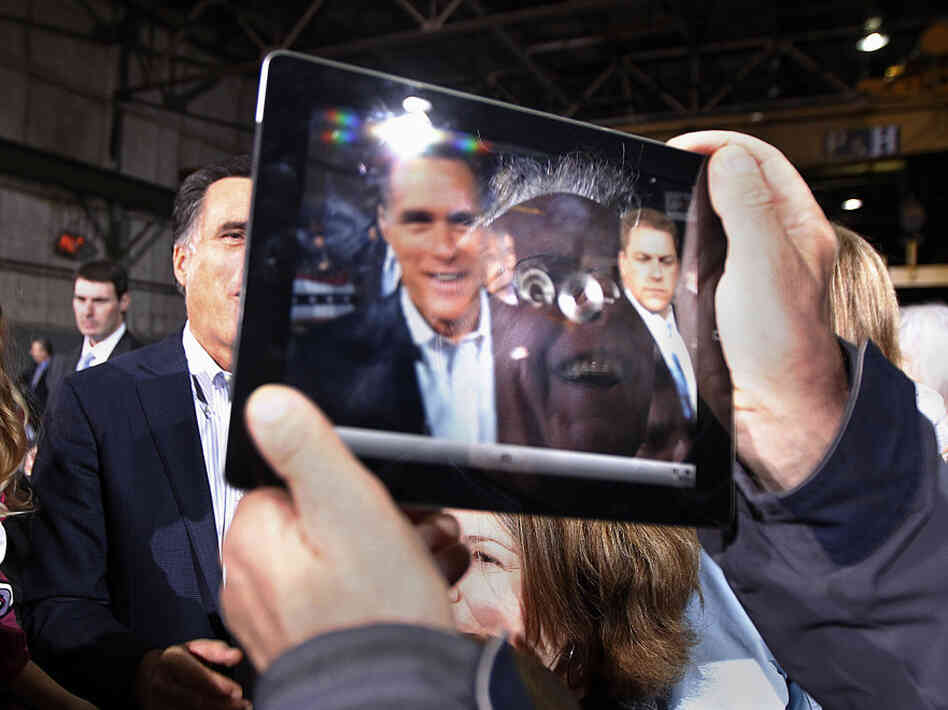 Mitt Romney was captured on the iPad screen held by a man at a campaign event in Toledo, Ohio, on Wednesday. 