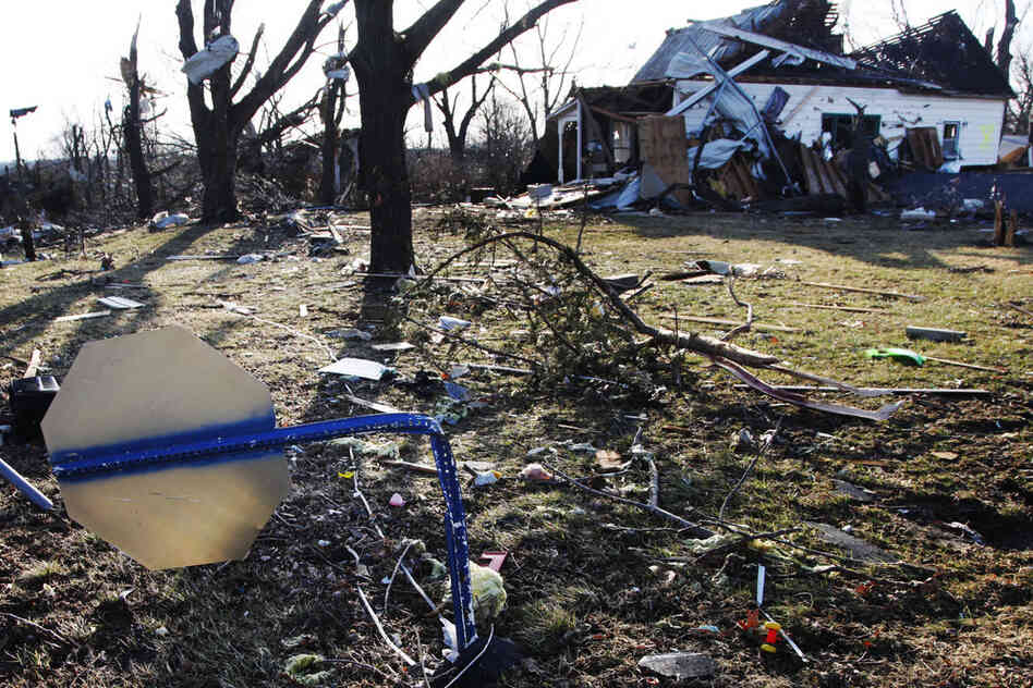 A damaged stop sign stands on a street corner in Harveyville. 