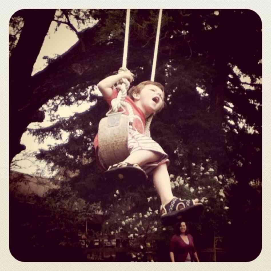 May Goar, 9: This photo is filled with things I love. My grandparents' farm is in Northern California. I love to visit them. They have a giant swing that makes you feel like a bird flying. My brother looks like he is excited and my mom is smiling, watching us. When I look at this picture I feel happy because it reminds me of many fun visits to the farm.