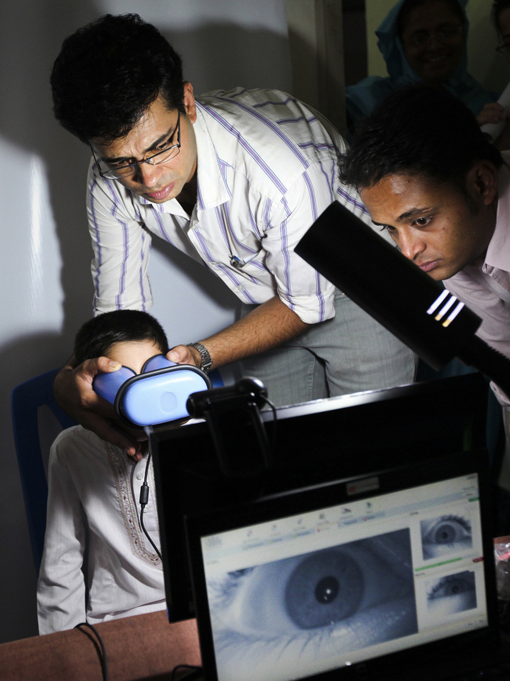 An Indian boy gets his eyes scanned for enrollment in a nationwide ID project in 2011. Many Indians, especially the poor, lack identification documents, which restricts their access to many government services. 