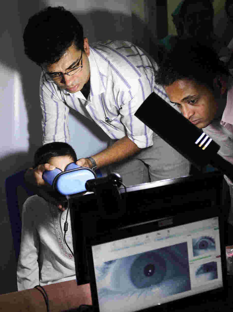 An Indian boy gets his eyes scanned for enrollment in a nationwide ID project in 2011. Many Indians, especially the poor, lack identification documents, which restricts their access to many government services. 
