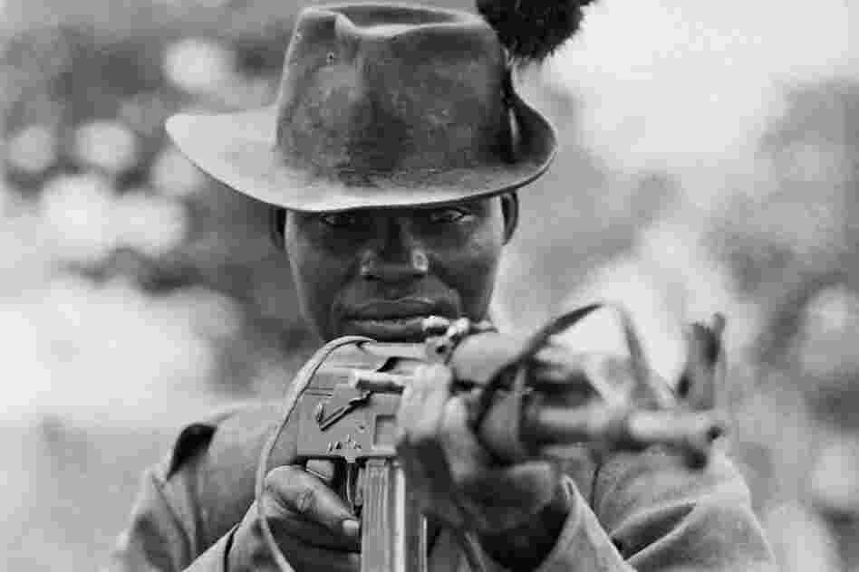 A Sudanese fighter holds his AK-47 at the ready in 1971. The gun's simple, intuitive design has made it popular among small-arms dealers, as well as insurgents, terrorists and child soldiers. 