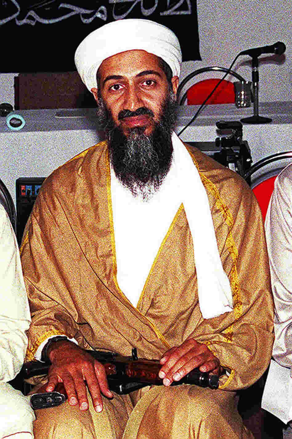 An undated photo of Osama bin Laden shows him with an AK-47 in his lap. 