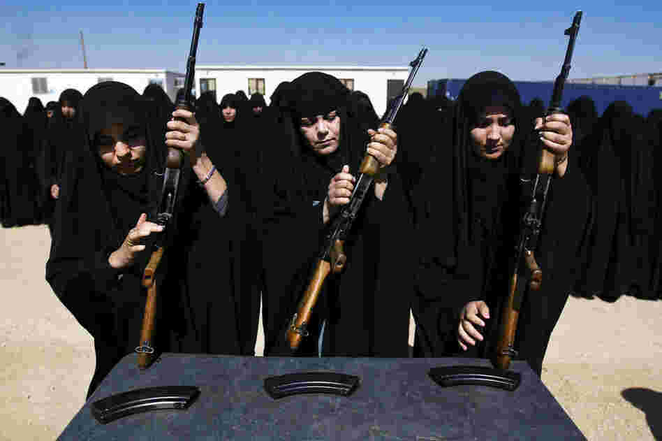 Iraqi police cadets are trained to use AK-47s in Karbala, Iraq, on March 26, 2009. 