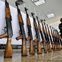 A Colombian police officer stands guard next to seized Chinese-made AK-47 replicas on Nov. 18, 2009. The guns have become so ubiquitous around the world that Russia's planned redesign may not do much to booster sales. A Colombian police officer stands guard next to seized Chinese-made AK-47 replicas on Nov. 18, 2009. The guns have become so ubiquitous around the world that Russia's planned redesign may not do much to booster sales.