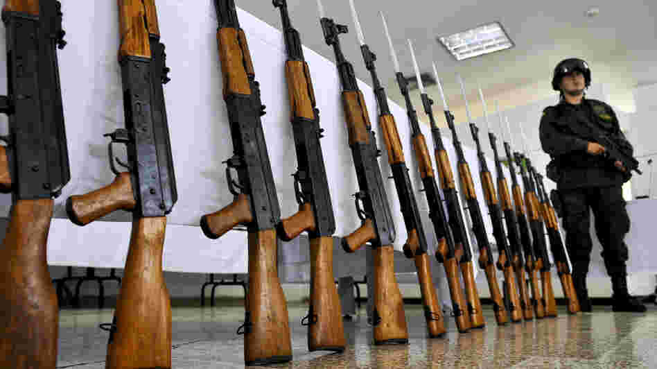 A Colombian police officer stands guard next to seized Chinese-made AK-47 replicas on Nov. 18, 2009. The guns have become so ubiquitous around the world that Russia's planned redesign may not do much to booster sales. A Colombian police officer stands guard next to seized Chinese-made AK-47 replicas on Nov. 18, 2009. The guns have become so ubiquitous around the world that Russia's planned redesign may not do much to booster sales.