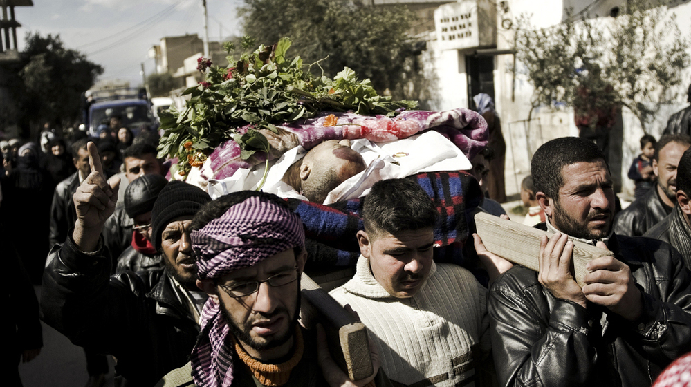 Syrian mourners in Qusayr, a few miles outside Homs, carry the body of a man killed by shrapnel, during his funeral on Tuesday. After a month-long assault by the Syrian army, rebels were forced to retreat from Homs on Thursday. 