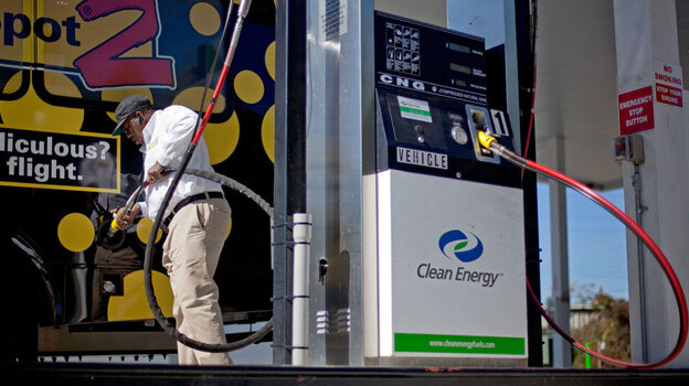 Bob Davis fills up his airport shuttle van at a natural gas pumping station in College Park, Ga. A growing number of companies are considering converting their vehicle fleets to natural gas. Bob Davis fills up his airport shuttle van at a natural gas pumping station in College Park, Ga. A growing number of companies are considering converting their vehicle fleets to natural gas.