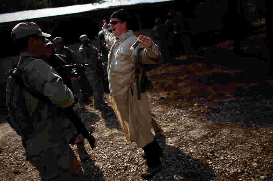 A terrorist role-player detonates his suicide vest in front of Afghan security forces.