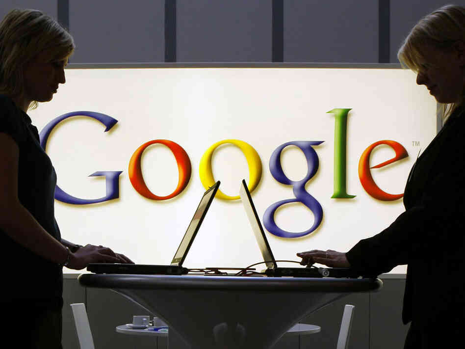 Exhibitors of the Google company work in front of a illuminated sign at the industrial fair Hannover Messe in Hanover, Germany, Tuesday, April 17, 2007. Exhibitors of the Google company work in front of a illuminated sign at the industrial fair Hannover Messe in Hanover, Germany, Tuesday, April 17, 2007.