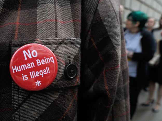 A line of people wait outside the 11th U.S. Circuit Court of Appeals, which heard arguments over tough new laws targeting illegal immigration in Alabama and Georgia on Thursday.  
