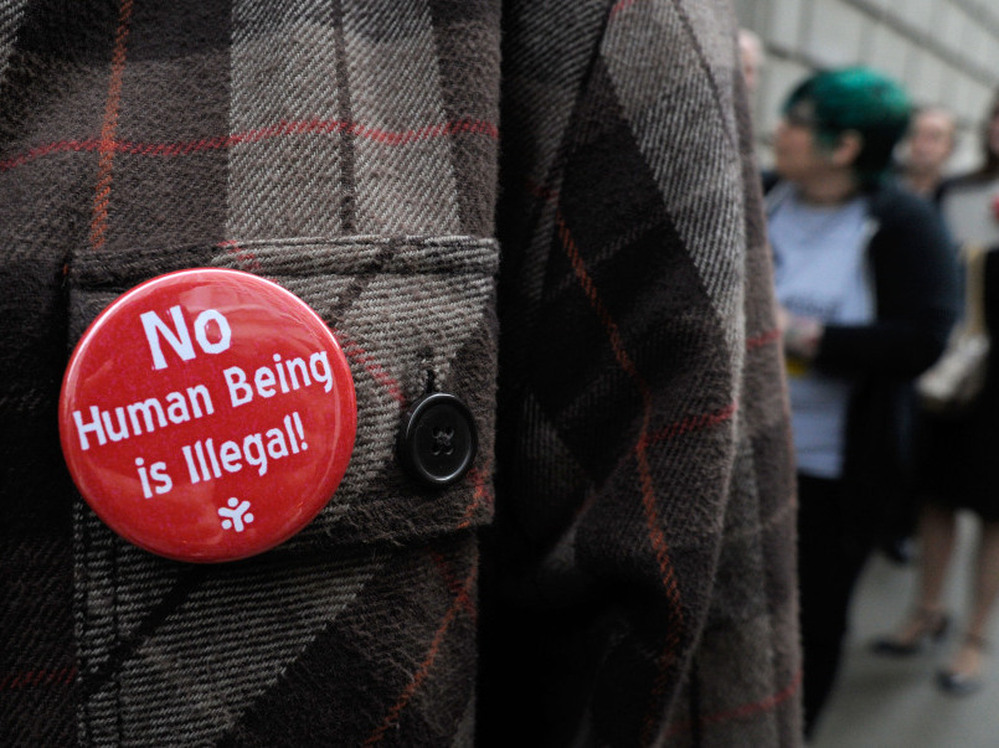 A line of people wait outside the 11th U.S. Circuit Court of Appeals, which heard arguments over tough new laws targeting illegal immigration in Alabama and Georgia on Thursday.  