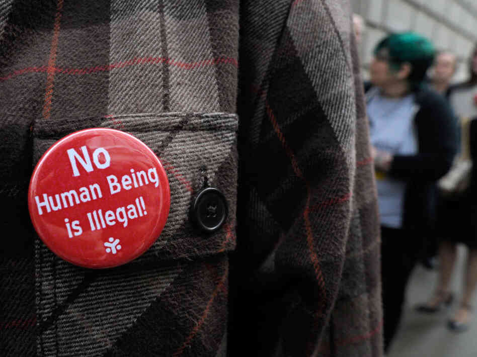 A line of people wait outside the 11th U.S. Circuit Court of Appeals, which heard arguments over tough new laws targeting illegal immigration in Alabama and Georgia on Thursday.  