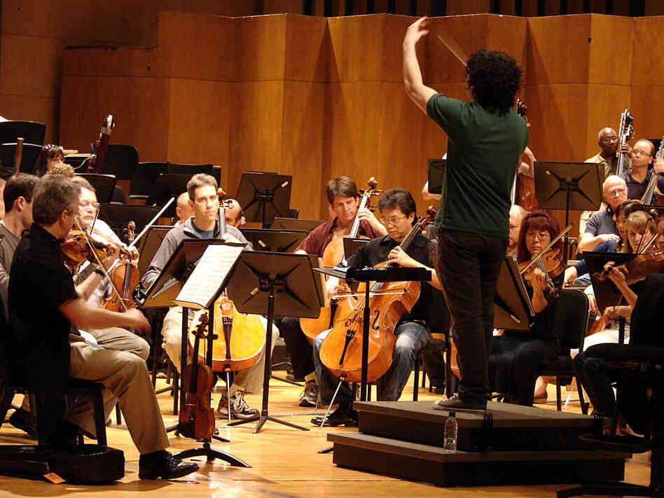 Conductor Gustavo Dudamel leads the L.A. Philharmonic in a rehearsal of Mahler's Symphony No. 4, on tour last month in Caracas, Venezuela.