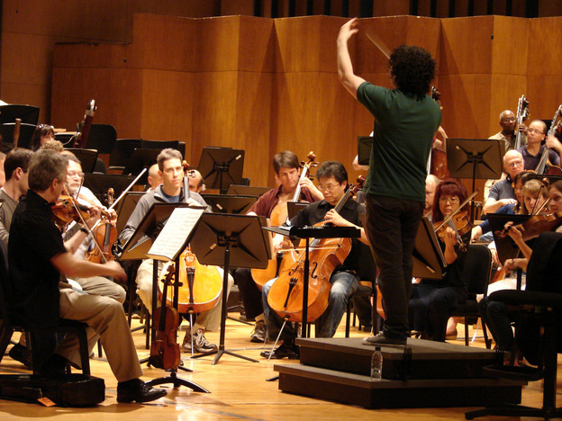 Conductor Gustavo Dudamel leads the L.A. Philharmonic in a rehearsal of Mahler's Symphony No. 4, on tour last month in Caracas, Venezuela.