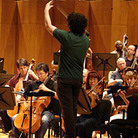 Conductor Gustavo Dudamel leads the L.A. Philharmonic in a rehearsal of Mahler's Symphony No. 4, on tour last month in Caracas, Venezuela. Conductor Gustavo Dudamel leads the L.A. Philharmonic in a rehearsal of Mahler's Symphony No. 4, on tour last month in Caracas, Venezuela.