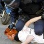 Police restrain a student protesting against education cuts during a rally in Valencia, in eastern Spain, on Feb. 20. Spaniards are beginning to feel the effects of $20 billion in austerity measures, and discontent is growing. Police restrain a student protesting against education cuts during a rally in Valencia, in eastern Spain, on Feb. 20. Spaniards are beginning to feel the effects of $20 billion in austerity measures, and discontent is growing.