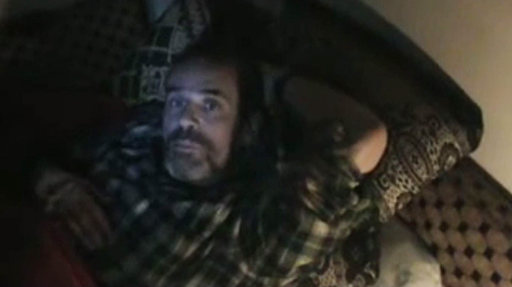An image grab from a video uploaded on YouTube shows Paul Conroy in the Syrian city of Homs.