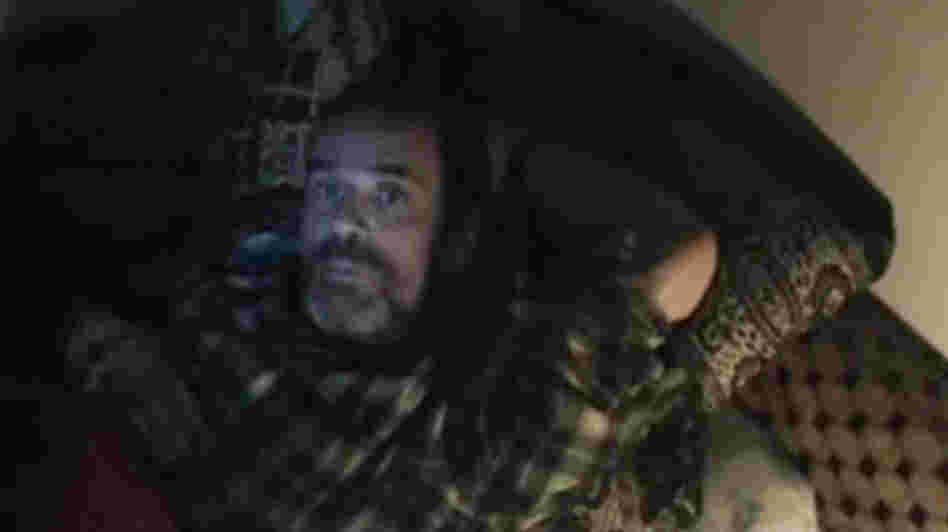An image grab from a video uploaded on YouTube shows Paul Conroy in the Syrian city of Homs.