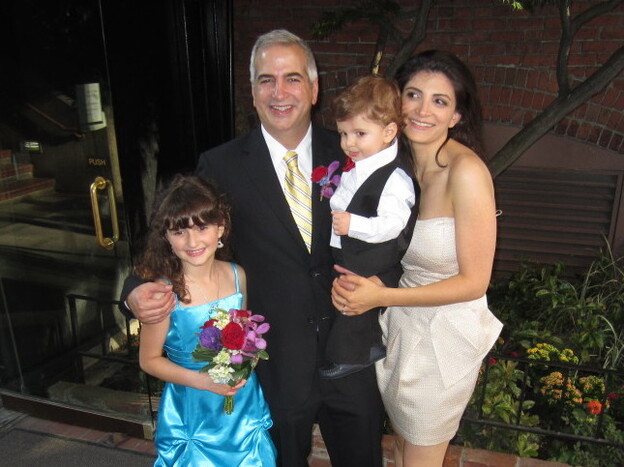 Shadid stands with wife Nada, son Malik and daughter Laila at his brother's wedding last summer.
