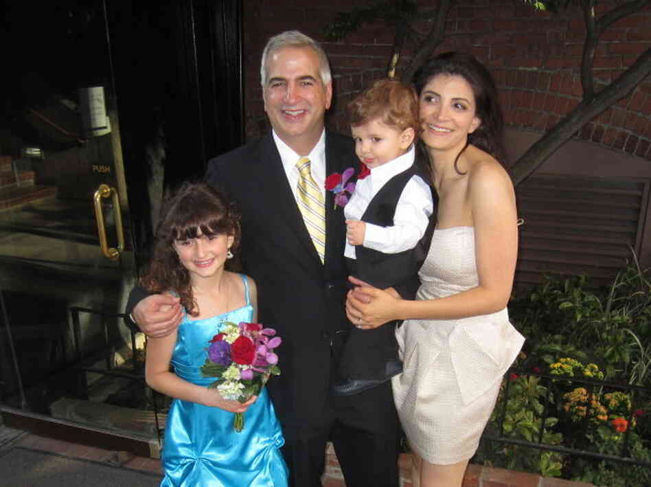 Shadid stands with wife Nada, son Malik and daughter Laila at his brother's wedding last summer.
