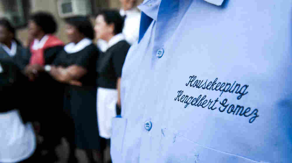 New York hotel workers protest at a hearing for former International Monetary Fund chief Dominique Strauss-Kahn in June 2011. Under a new contract, workers will receive "panic buttons" to use if they fear for their safety. They also won several other significant benefits. New York hotel workers protest at a hearing for former International Monetary Fund chief Dominique Strauss-Kahn in June 2011. Under a new contract, workers will receive "panic buttons" to use if they fear for their safety. They also won several other significant benefits.