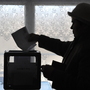There were widespread allegations of fraud in Russia's parliamentary polls in December. In advance of Russia's presidential election Sunday, Russian citizens abroad have been allowed to vote early. This woman casts a ballot in Kyrgyzstan on Feb. 26. There were widespread allegations of fraud in Russia's parliamentary polls in December. In advance of Russia's presidential election Sunday, Russian citizens abroad have been allowed to vote early. This woman casts a ballot in Kyrgyzstan on Feb. 26.