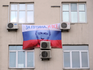 A portrait of Russian prime minister and presidential candidate Vladimir Putin, bearing the slogan A portrait of Russian prime minister and presidential candidate Vladimir Putin, bearing the slogan