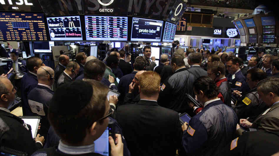 Traders work on the floor of the New York Stock Exchange moments after the opening bell Feb. 24. Traders work on the floor of the New York Stock Exchange moments after the opening bell Feb. 24.