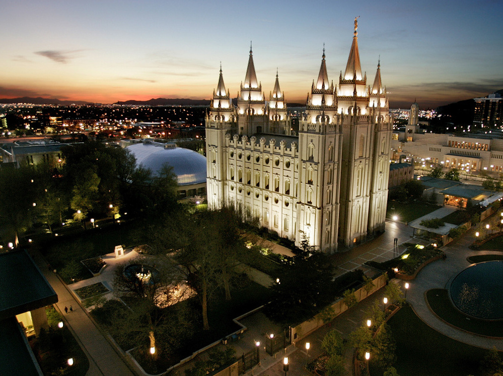 The sun sets behind the Mormon Temple, the centerpiece of Temple Square, in Salt Lake City.