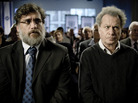 Uriel Shkolnik (Lior Ashkenazi, left) sits with his father and fellow Talmudic scholar Eliezer (Shlomo Bar Aba); when news of a singular honor comes for the latter, the two men's lives are thrown into turmoil. Uriel Shkolnik (Lior Ashkenazi, left) sits with his father and fellow Talmudic scholar Eliezer (Shlomo Bar Aba); when news of a singular honor comes for the latter, the two men's lives are thrown into turmoil.