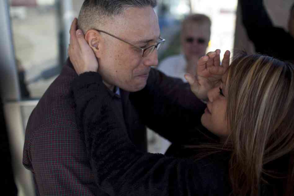 Ernie Lopez hugs his daughter, Nikki, for the first time since 2009. Ernie was released from prison on March 2.