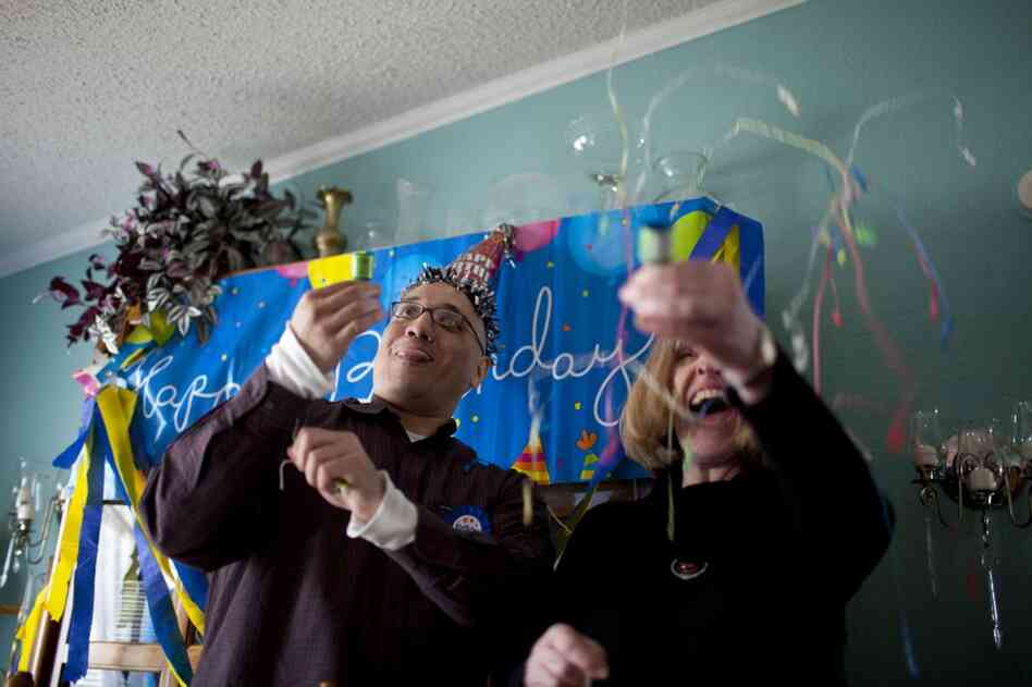 Lopez and his attorney, Heather Kirkwood, celebrate one of his many missed birthdays during his release party at his family's home.