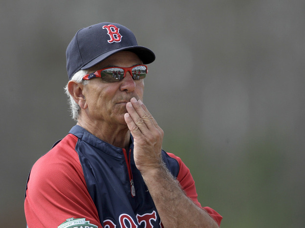 Boston Red Sox manager Bobby Valentine watches over a baseball spring training workout.