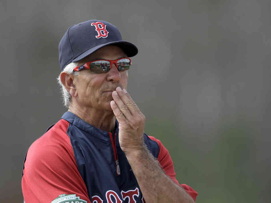 Boston Red Sox manager Bobby Valentine watches over a baseball spring training workout.