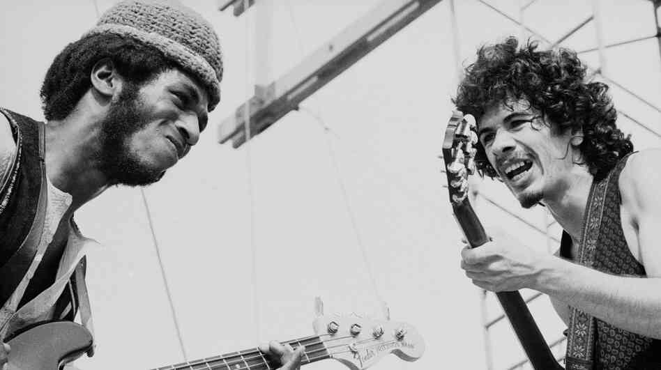 Carlos Santana with bassist David Brown performing at Woodstock.