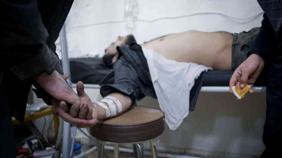A wounded Syrian undergoes treatment at a makeshift hospital in a house in the Baba Amr district of the central city of Homs. A wounded Syrian undergoes treatment at a makeshift hospital in a house in the Baba Amr district of the central city of Homs.