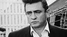 Johnny Cash walks inside the gates of Folsom Prison, preparing to perform his fourth concert for inmates there. Johnny Cash walks inside the gates of Folsom Prison, preparing to perform his fourth concert for inmates there.