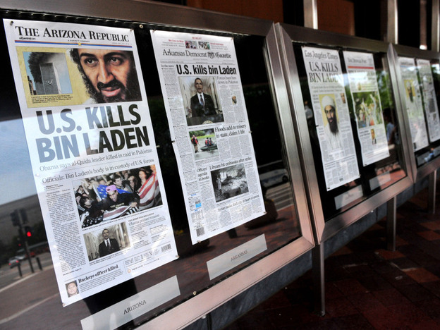 A new study suggests ways newspapers can survive in the digital world. Here dead-tree versions of front pages from around the country announce the death of Osama bin Laden  in front of the Newseum in Washington on May 2, 2011. 