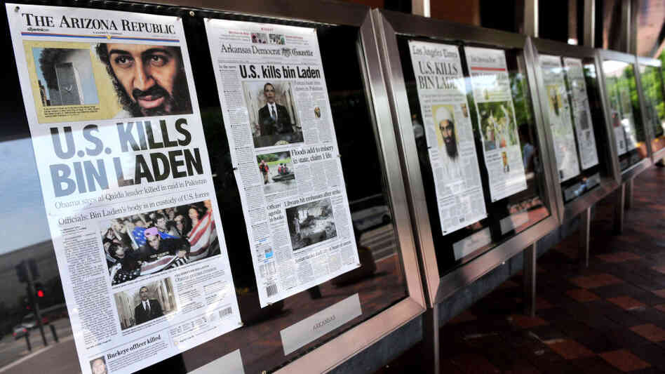 A new study suggests ways newspapers can survive in the digital world. Here dead-tree versions of front pages from around the country announce the death of Osama bin Laden  in front of the Newseum in Washington on May 2, 2011. 