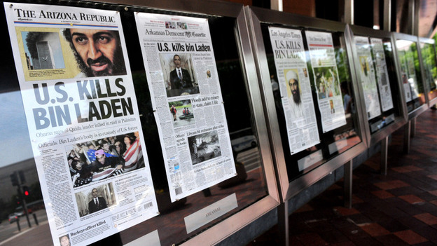 A new study suggests ways newspapers can survive in the digital world. Here dead-tree versions of front pages from around the country announce the death of Osama bin Laden in front of the Newseum in Washington on May 2, 2011. A new study suggests ways newspapers can survive in the digital world. Here dead-tree versions of front pages from around the country announce the death of Osama bin Laden in front of the Newseum in Washington on May 2, 2011.