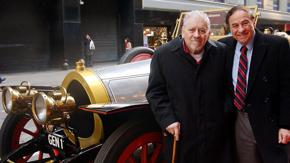 Composer/lyricist Robert Sherman (left) and his brother Richard stand next to the car used in the 1968 film Chitty Chitty Bang Bang. The brothers wrote the songs for the movie, as well as a musical version that began running in 2002.